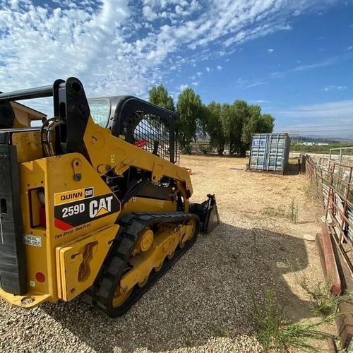 A machine doing an Pool Demolition, grading and leveling